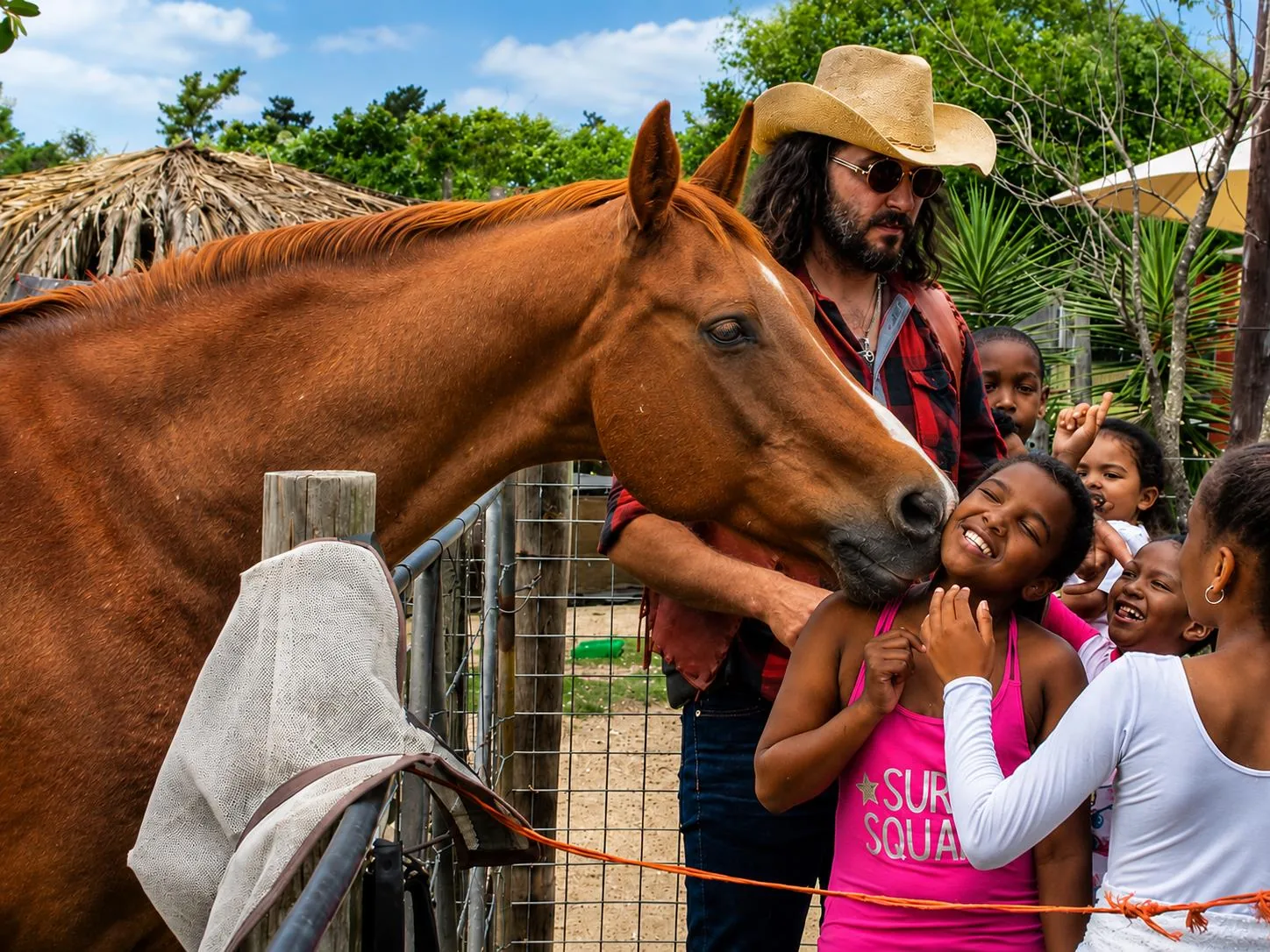 Children greeting horse with handler at Lat Wai